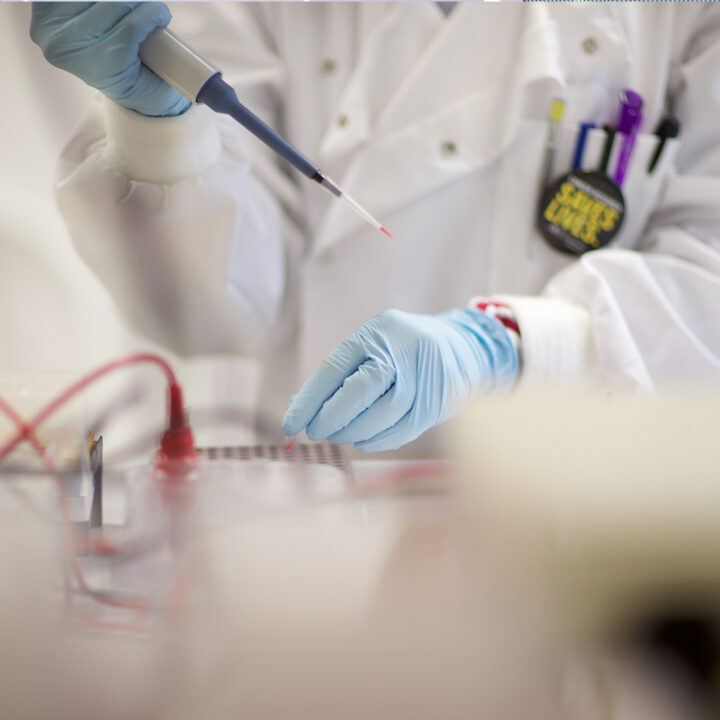 Scientist Pippetting in the OCRB Laboratory